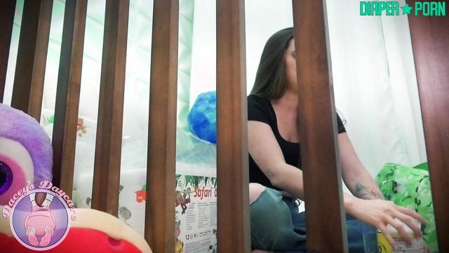 Black-haired Dacey drooling over bottle in nappy - Dacey's Daycare