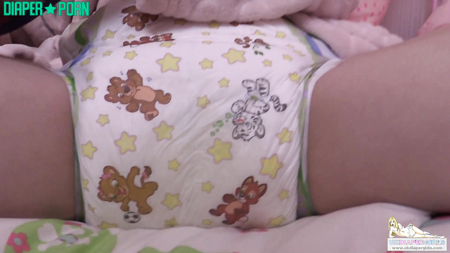 Brunette Chloe grinding hard with magazine - UKDiaperGirls