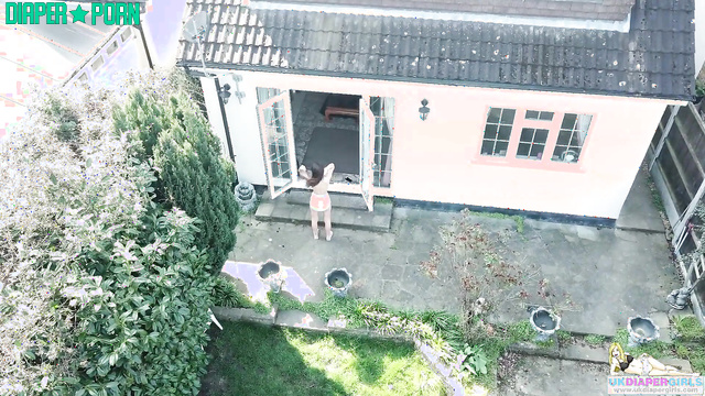 Topless Jess squatting in nappy, fingers pressing - UKDiaperGirls