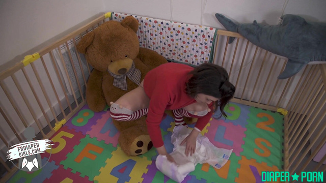 Brunette in long socks, pissing hard in diaper - FRDiapergirls