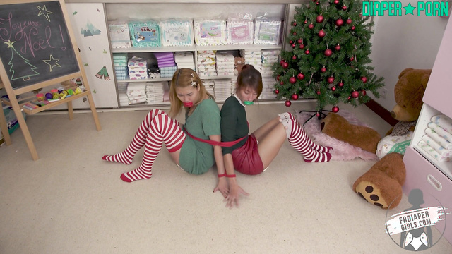 Elve bound tight, diaper change under Christmas lights - FRDiapergirls