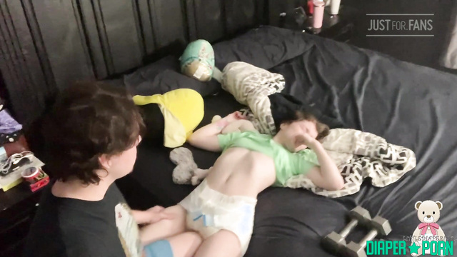 Brunette in socks teasing, squatting in snug nappy - LittleDiaperIdol