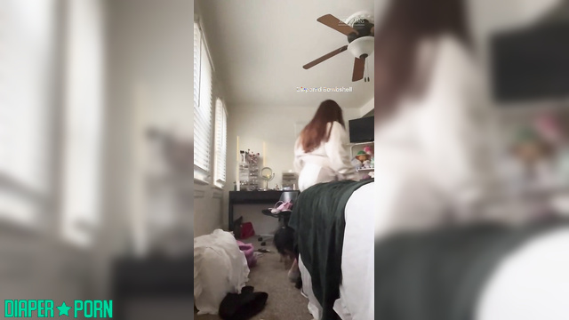 Sunbunnystella - Teasing with her full pampers, playfully looking around