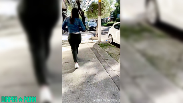 Brunette outdoors with pampers peeking - BabyPeachy