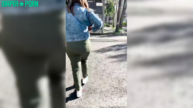 Brunette outdoors with pampers peeking - BabyPeachy
