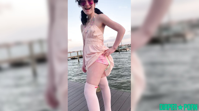 Brunette teasing outdoors, diaper hidden under dress - LittleDiaperIdol