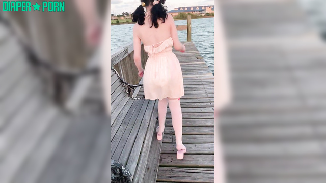 Brunette teasing outdoors, diaper hidden under dress - LittleDiaperIdol
