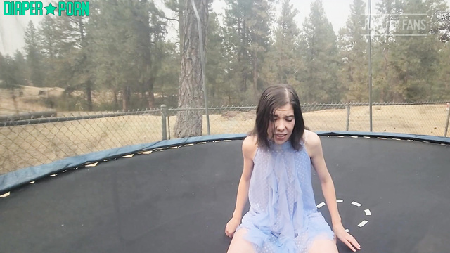 Brunette bouncing outdoors giggling as diaper crinkles - BabyFluffyBunny