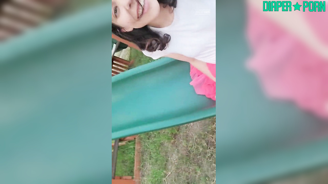 Brunette outdoors laughing, nappy exposed and playful - BabyFluffyBunny