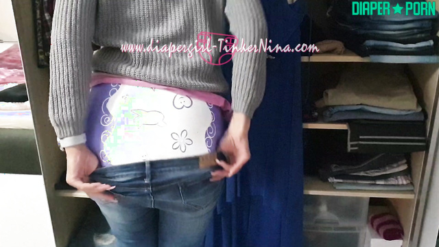 Brunette fingers pressing pampers snug - TinkerNina