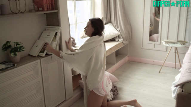 Stripped bare and powdered, diaper change on display - Diapers Days