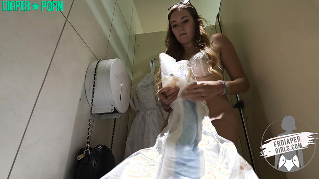 FRDiapergirls - Charlotte putting on a diaper in a public restroom