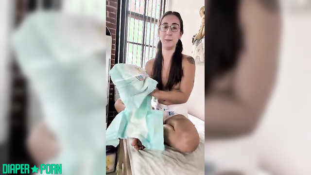 Brunette showed how to change a diaper correctly, look